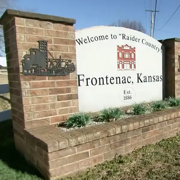 A welcome sign in Frontenac, Kansas that says Welcome to Raider Country, Frontenac, Kansas, established in 1886.