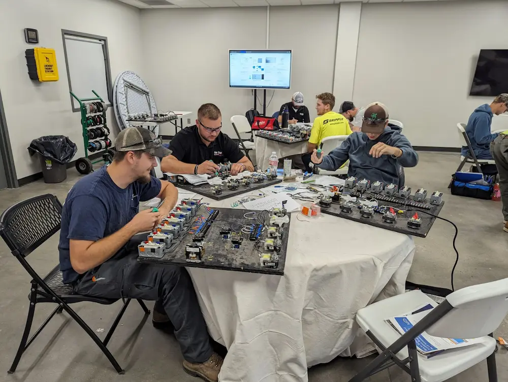 Group of people working with electrical panels