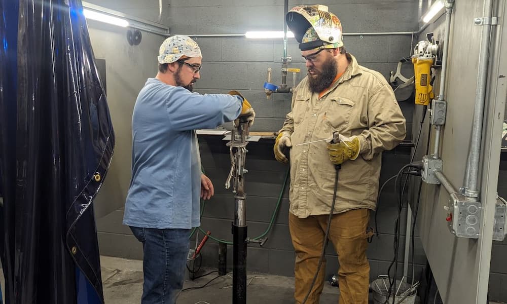 Two men working with equipment